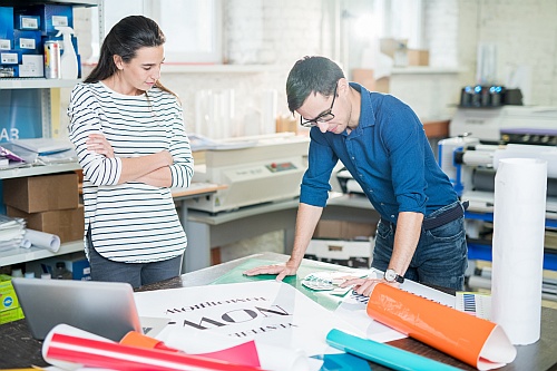 A print advertising team creating banner ads.